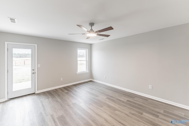 unfurnished room featuring hardwood / wood-style flooring and ceiling fan