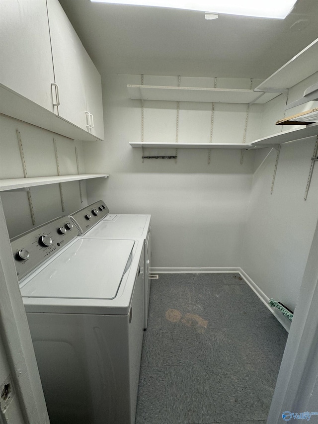 laundry area with cabinets and washing machine and dryer