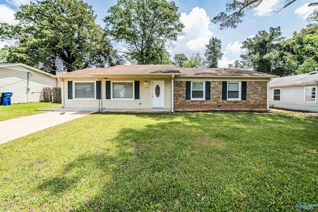 ranch-style home with a front lawn and brick siding