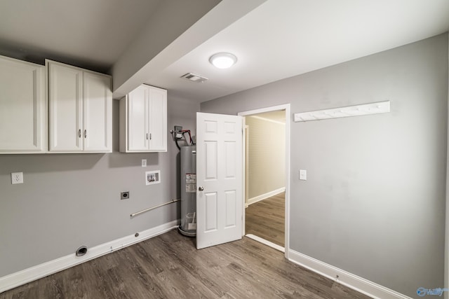 washroom featuring visible vents, washer hookup, water heater, cabinet space, and electric dryer hookup