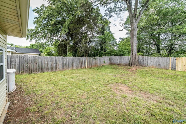 view of yard with a fenced backyard