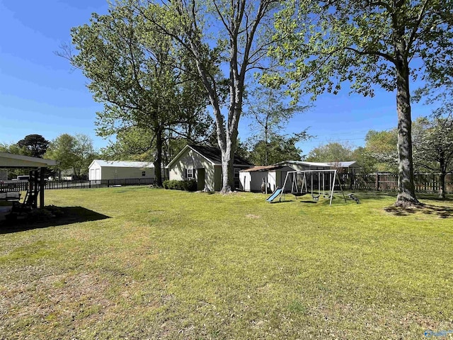 view of yard featuring a fenced backyard and a playground