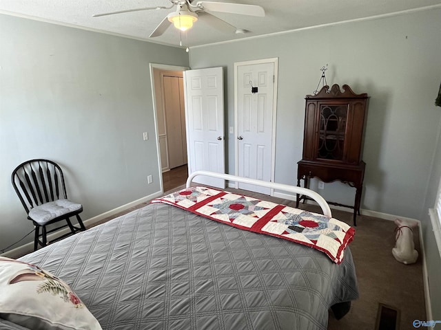 bedroom with ceiling fan, baseboards, and visible vents