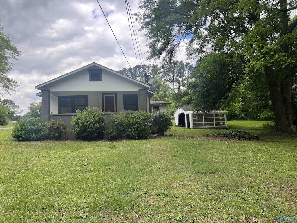 3322 Tabor Rd, Gadsden, AL 35904 - view of home's exterior featuring a lawn and an outbuilding