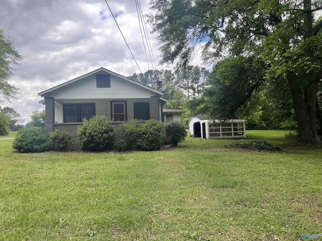 3322 Tabor Rd, Gadsden, AL 35904 - view of home's exterior featuring a lawn and an outbuilding