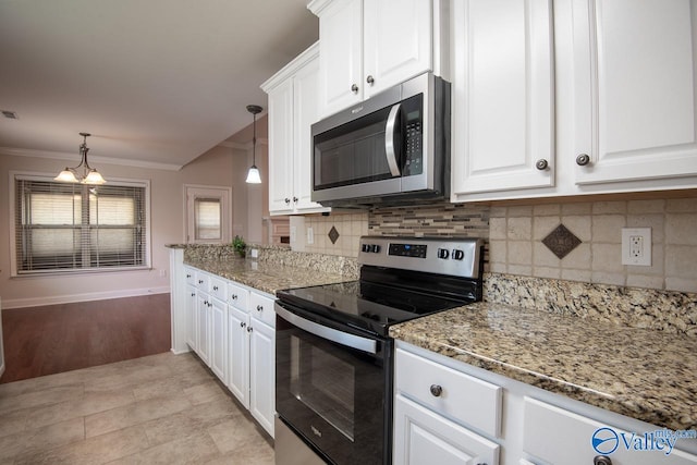 kitchen with white cabinetry, an inviting chandelier, light hardwood / wood-style flooring, pendant lighting, and appliances with stainless steel finishes