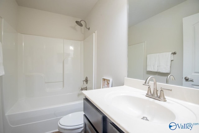 full bathroom with washtub / shower combination, vanity, and toilet