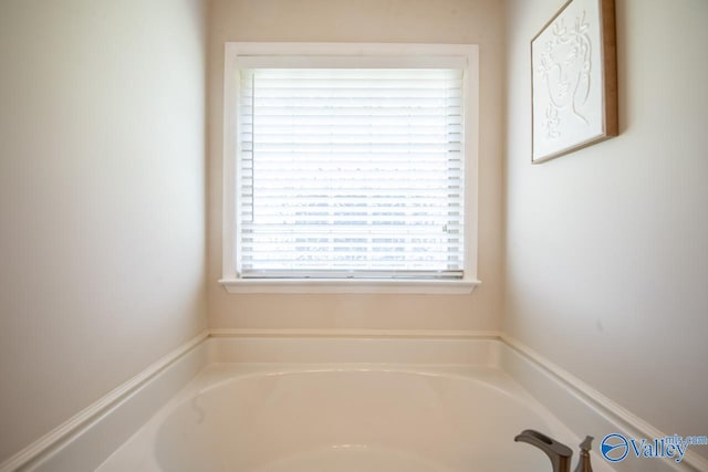 bathroom with a washtub