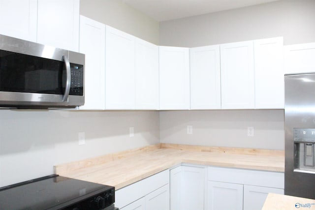 6200 Dalewood Ln, Guntersville, AL 35976 - kitchen featuring stainless steel appliances and white cabinetry