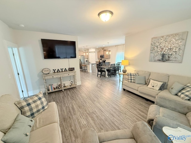 101 River Springs Ct, New Market, AL 35761 - living room with wood finished floors and baseboards