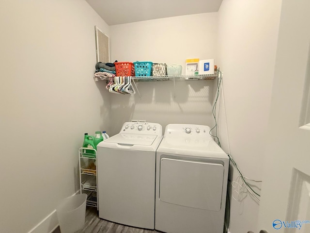 101 River Springs Ct, New Market, AL 35761 - laundry room with washing machine and dryer and wood finished floors