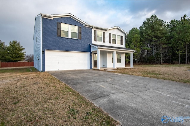 view of front facade featuring a garage, covered porch, and a front lawn