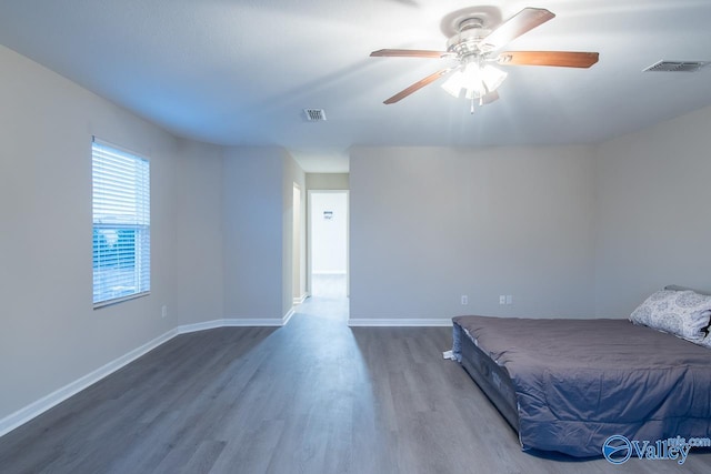 bedroom featuring ceiling fan and wood-type flooring