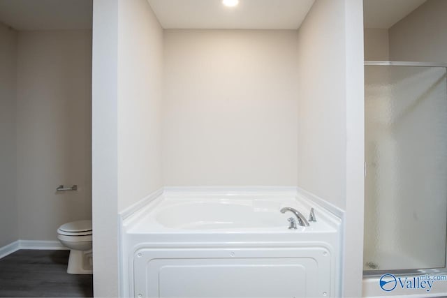 bathroom featuring wood-type flooring, toilet, and independent shower and bath