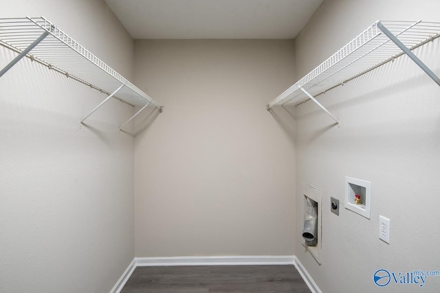 clothes washing area featuring washer hookup, electric dryer hookup, and dark hardwood / wood-style floors