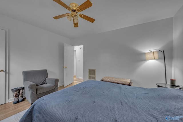 bedroom with ceiling fan and light wood-type flooring