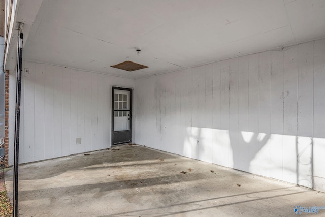 empty room with wood walls