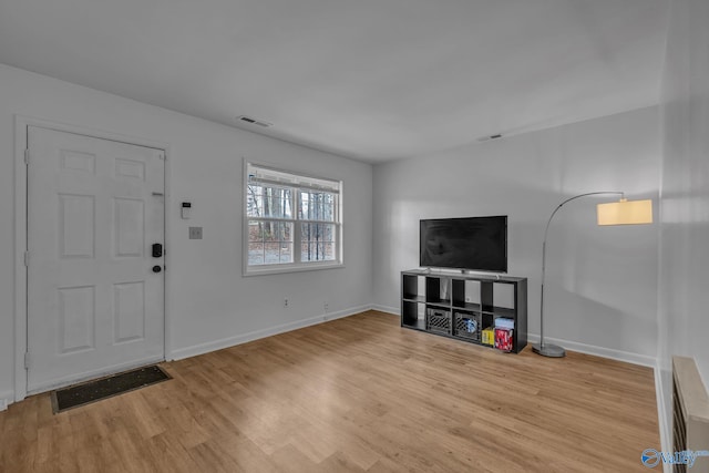 entryway with light hardwood / wood-style flooring