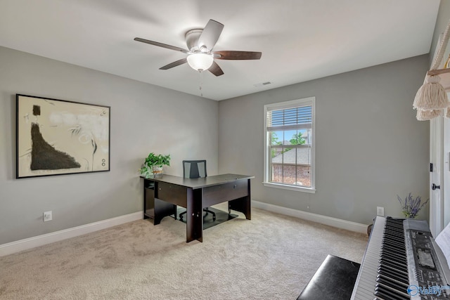 office with carpet, visible vents, baseboards, and ceiling fan