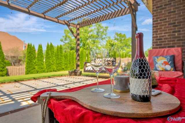 view of patio / terrace featuring fence and a pergola