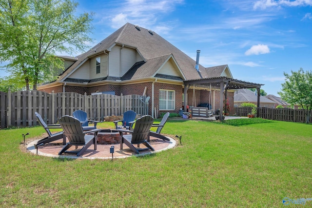 rear view of house featuring a fire pit, a pergola, a lawn, a shingled roof, and a fenced backyard
