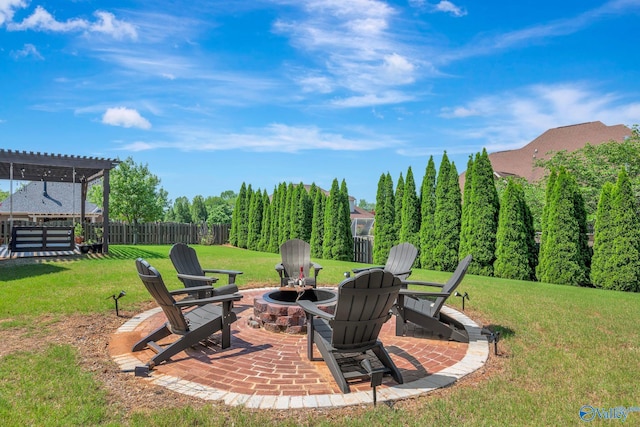 view of yard with an outdoor fire pit, a patio, a pergola, and fence