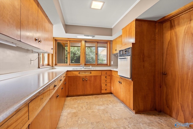 kitchen with white oven and sink