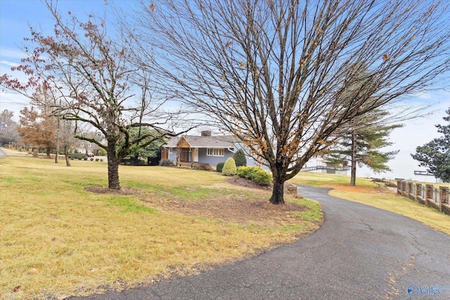 ranch-style home with a front yard