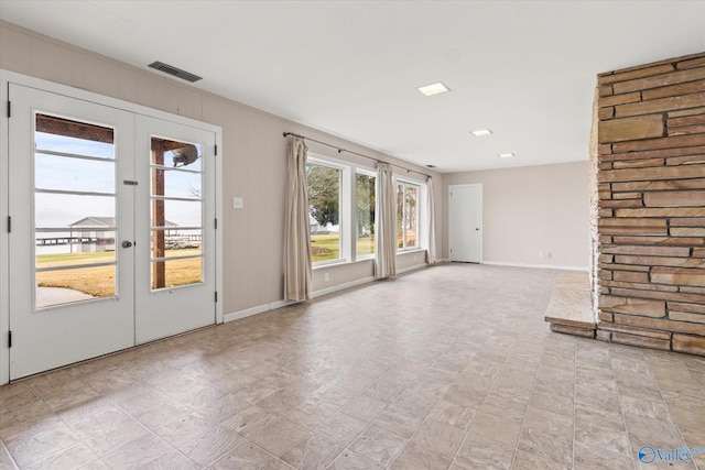 unfurnished living room with french doors