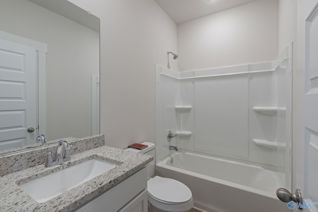 full bathroom featuring washtub / shower combination, vanity, and toilet