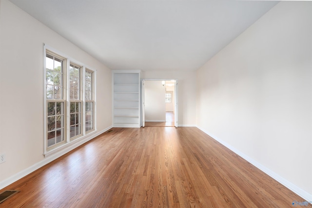 empty room featuring wood-type flooring