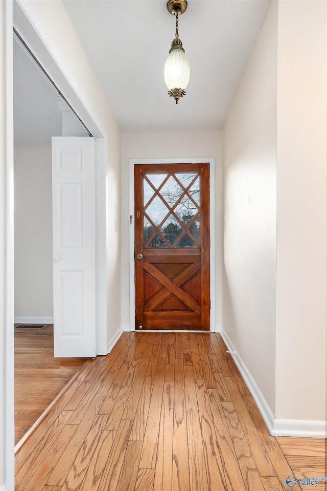 entryway with hardwood / wood-style floors