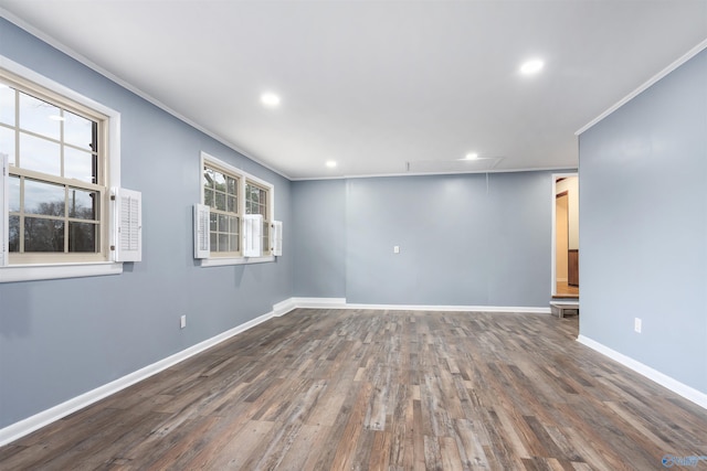 spare room with crown molding and dark hardwood / wood-style flooring