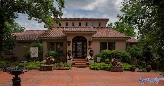 rear view of property featuring a patio