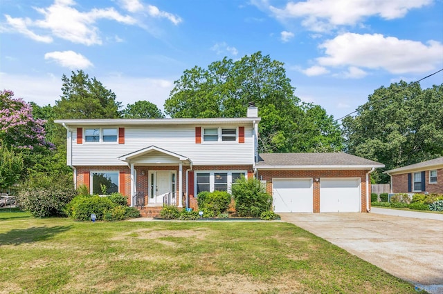 11303 Crestfield Dr, Huntsville, AL 35803 - view of front facade with brick siding, an attached garage, concrete driveway, a front yard, and a chimney