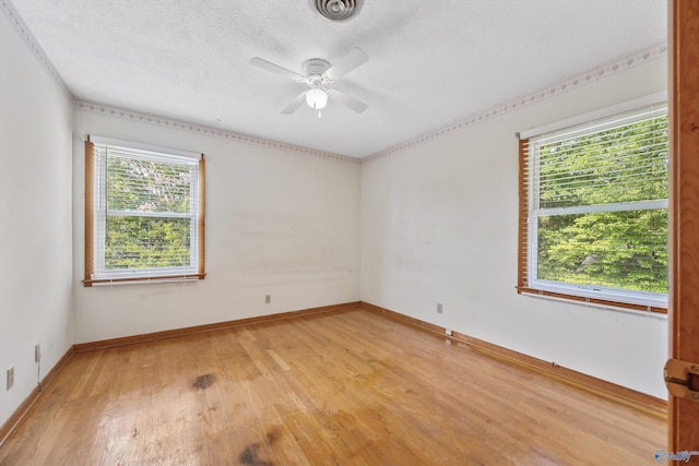 11303 Crestfield Dr, Huntsville, AL 35803 - empty room featuring light wood-style flooring, a ceiling fan, baseboards, and a textured ceiling