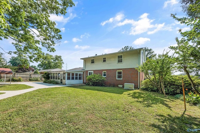 11303 Crestfield Dr, Huntsville, AL 35803 - back of house with brick siding and a sunroom