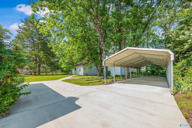 11303 Crestfield Dr, Huntsville, AL 35803 - view of patio featuring driveway and a detached carport