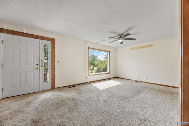 11303 Crestfield Dr, Huntsville, AL 35803 - foyer featuring ceiling fan, baseboards, a textured ceiling, and carpet floors
