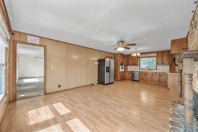 11303 Crestfield Dr, Huntsville, AL 35803 - kitchen with stainless steel appliances, light countertops, a sink, ceiling fan, and light wood-type flooring
