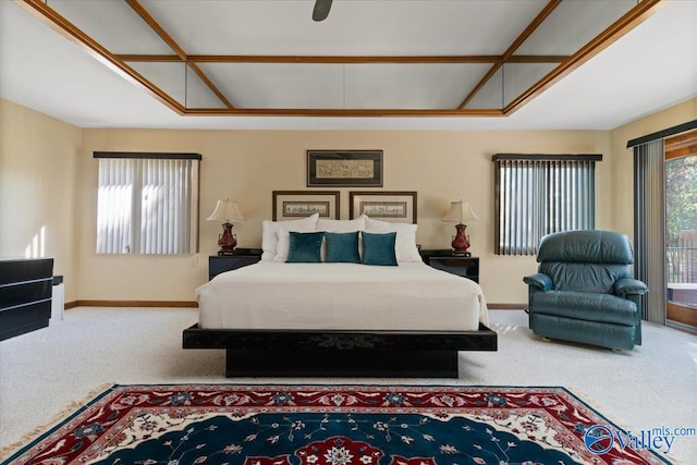 bedroom with access to exterior, ceiling fan, and carpet flooring