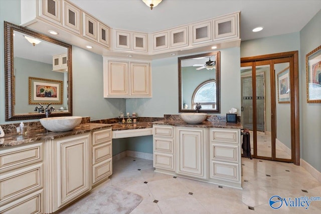 bathroom with tile patterned floors, ceiling fan, and vanity