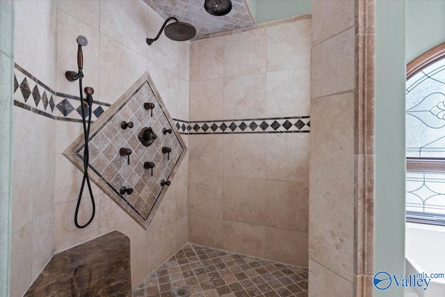 bathroom with tiled shower