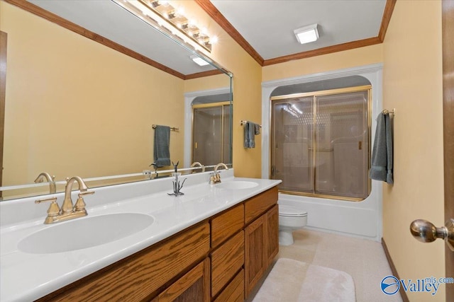 full bathroom with ornamental molding, vanity, toilet, and enclosed tub / shower combo