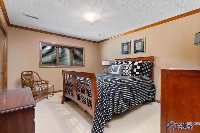 carpeted bedroom with ornamental molding and a textured ceiling