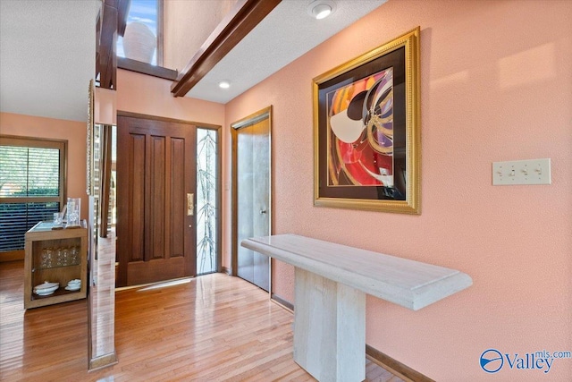 entryway with light hardwood / wood-style flooring