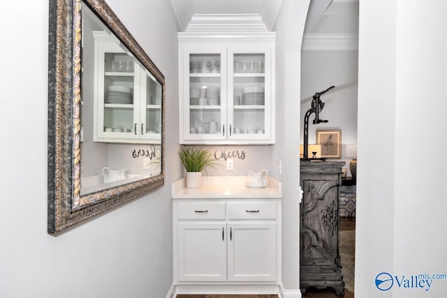bar featuring crown molding