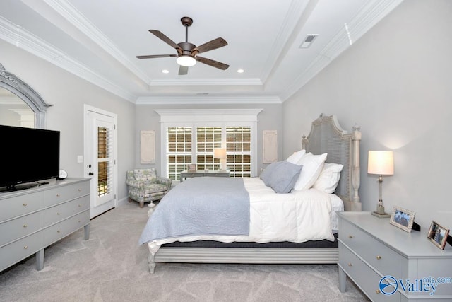 carpeted bedroom featuring a raised ceiling, access to exterior, a ceiling fan, visible vents, and crown molding