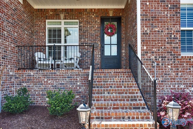 entrance to property with brick siding