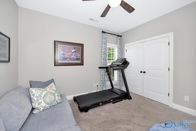 exercise room with carpet floors, visible vents, a ceiling fan, and baseboards